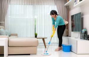 attractive-young-asian-woman-mopping-tile-floor-living-room-while-doing-cleaning-home-staying-home-using-free-time-about-their-daily-housekeeping-routine_73503-2033