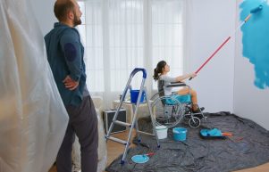 paralyzed-woman-painting-wall-with-roller-brush-sitting-wheelchair-handicapped-disabled-ill-immobilizes-woman-helping-with-apartment-redecoration-home-construction-while-renovating-im_482257-14146